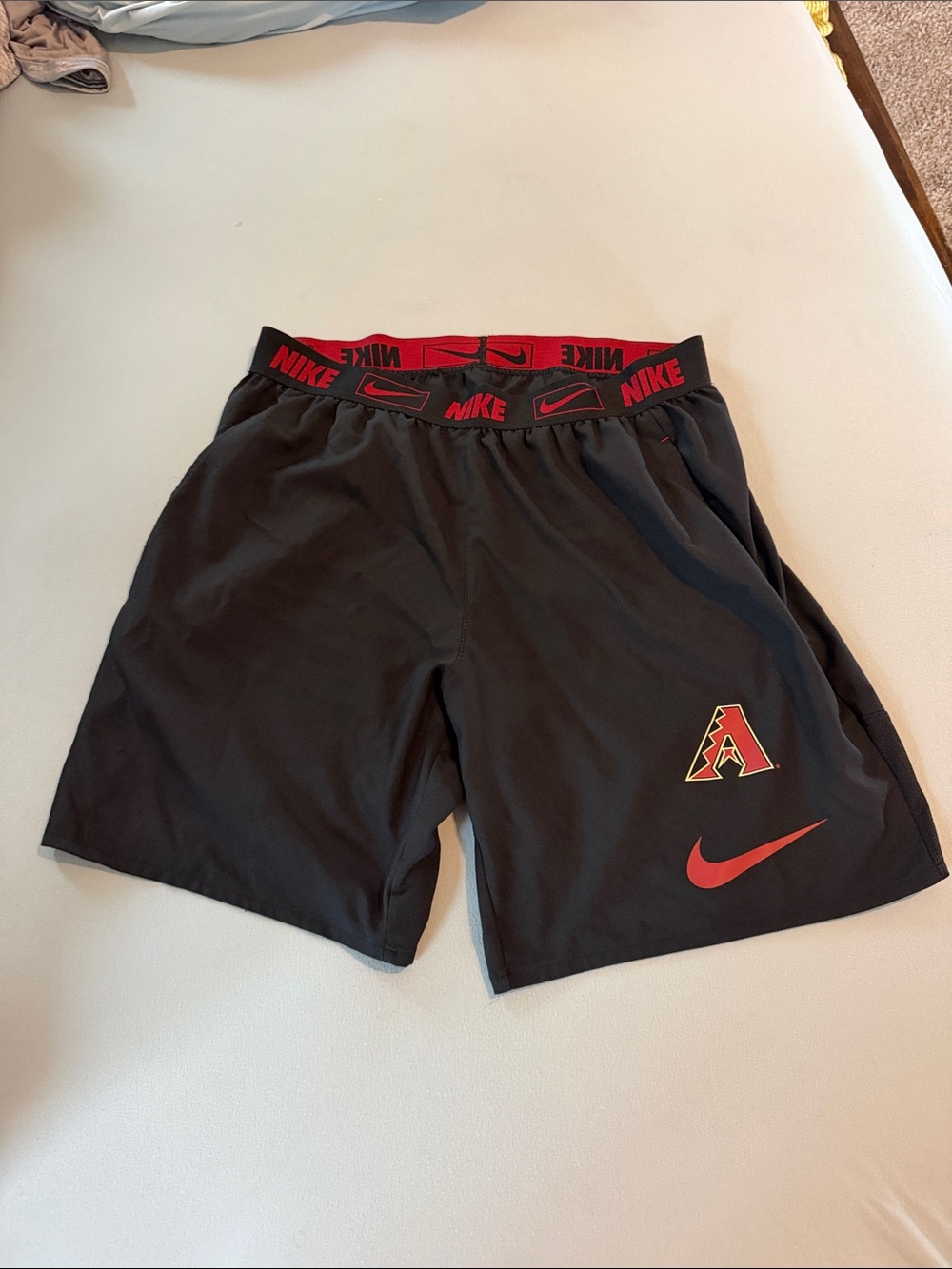 Nike Men’s Arizona Diamondbacks Black Athletic Shorts with Red Accents and